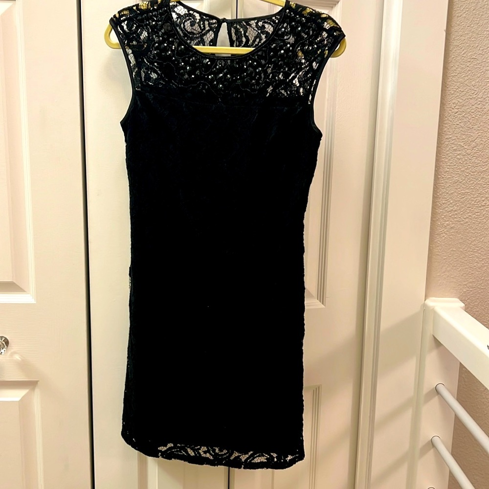 NWT  Black lace short sleeve dress with black beading on bodice. Lined. Size 6p